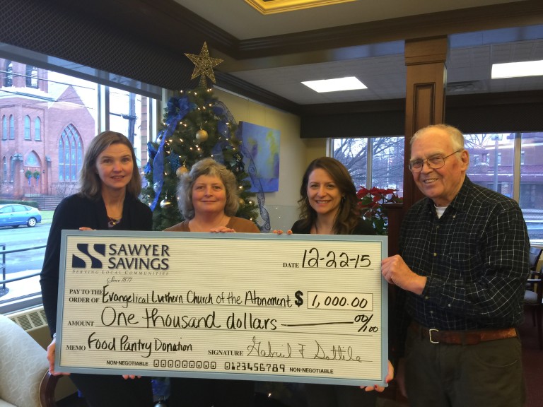 Saugerties Branch Manager Jenn Gutheil-Denier presents a check to The Evangelical Lutheran Church of the Atonement in support of their God Given Bread Food Program