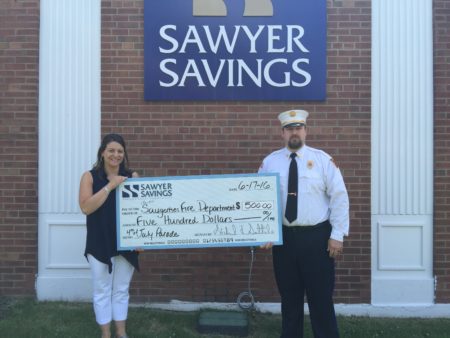4th of July photo of Accepting the donation is Chief Dave Mason and is pictured here along with Saugerties Branch Manager Jenn Gutheil-Denier