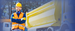 Small Business Person standing in front of large truck