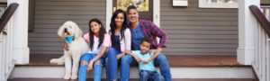 Lovely family on the steps of a house
