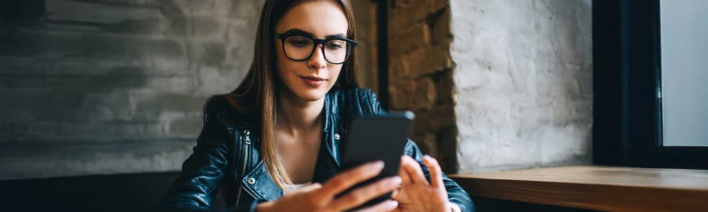 women using mobile phone but looks suspicious
