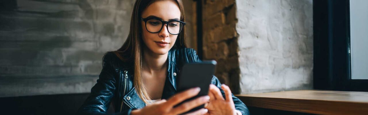 women using mobile phone but looks suspicious